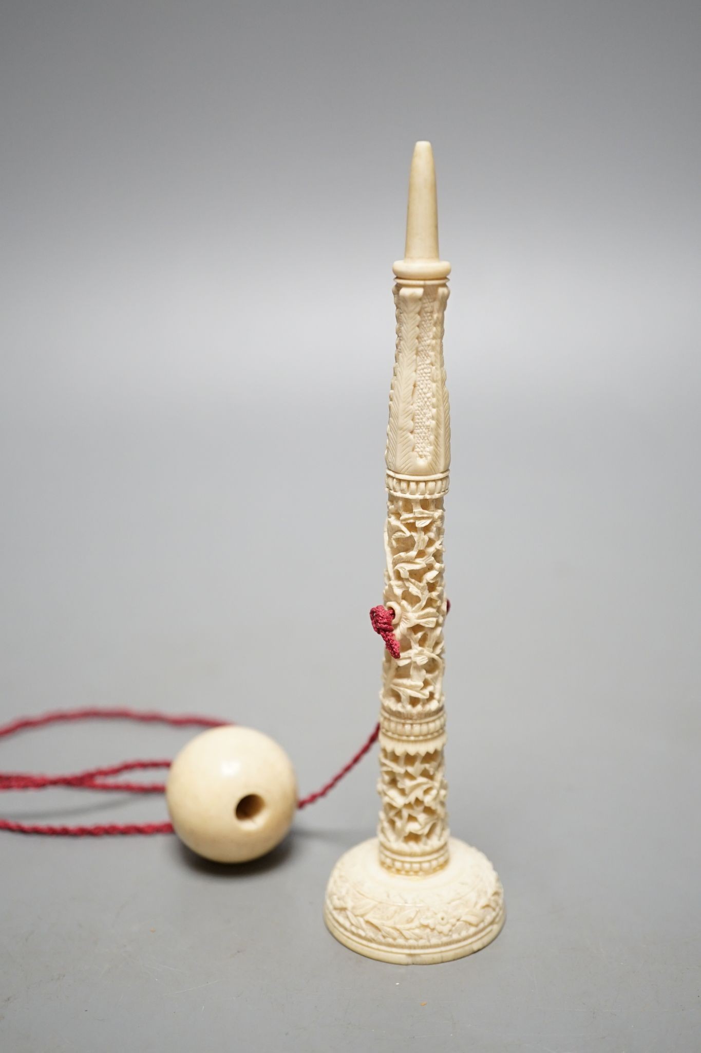 A Chinese export ivory spike and ball game, 16.5cm, and an ivory snuff bottle
